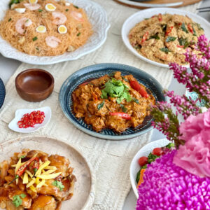 Mini Buffet Catering in Singapore- Assorted dishes on platter such as prawn, chicken with red sauce, noodles, fish and chili for garnish